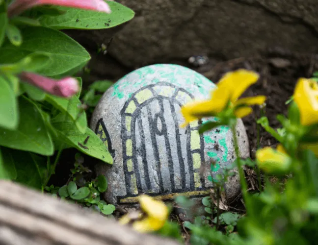 A painted rock in the garden - Applewood Healthcare