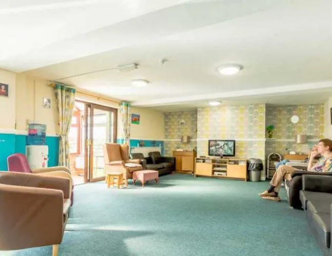 Lounge area with view of the garden in Apple Grove care home Cambridge - Applewood Healthcare